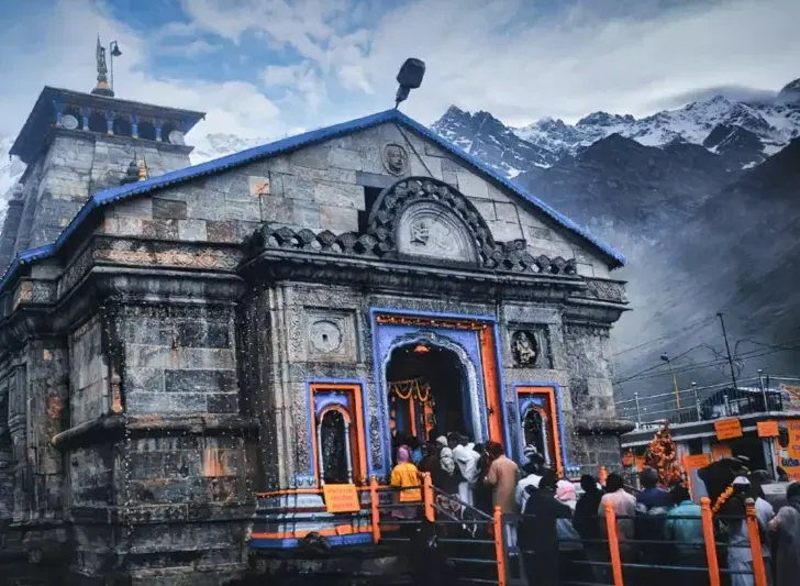 Pilgrims attending morning aarti and exploring spiritual attractions near Kedarnath Temple area