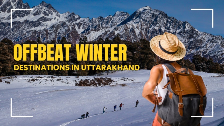 Traveler enjoying a snowy trail surrounded by Himalayan peaks in an offbeat winter destination in Uttarakhand.