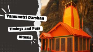 Yamunotri Temple in Uttarakhand with bright orange architecture surrounded by mountains